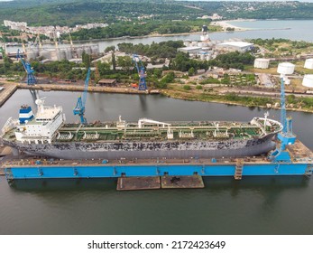 Tanker Vessel Repair In Dry Dock Shipyard, Aerial Top View