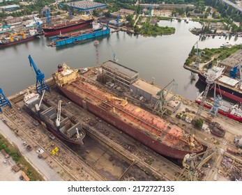 Tanker Vessel Repair In Dry Dock Shipyard, Aerial Top View