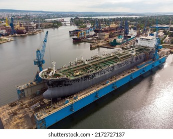 Tanker Vessel Repair In Dry Dock Shipyard, Aerial Top View