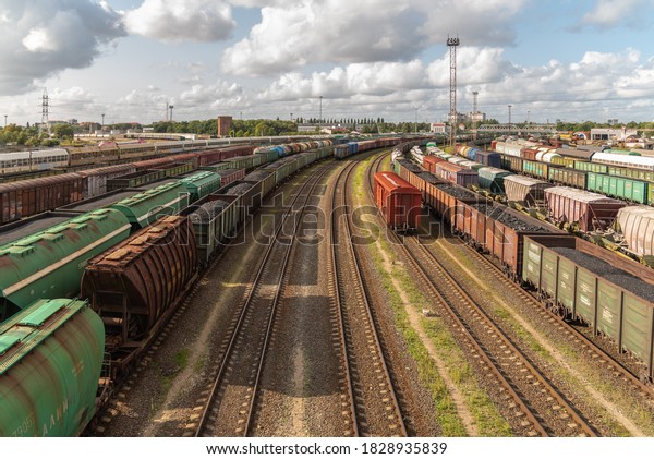 Tanks and freight cars at the sorting railway\
junction. Long railway trains for transportation of various goods.\
Railway transport\
logistics