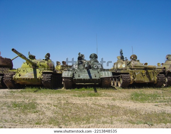 Tanks\
and other armored vehicles built in USSR gathered for disarmament\
as part of arms control. Russia donated these to Afghan army.\
Location: Herat, Afghanistan. Date: April 10,\
2005