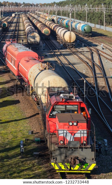 Tanks\
for the transportation of oil are on the railroad tracks.A train at\
the petroleum products terminal is ready to\
operate