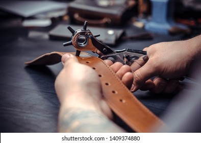 Tanner works as an artisan at the leather studio - Powered by Shutterstock