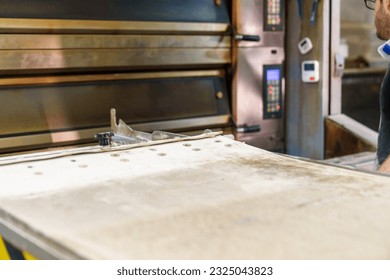 A tantalizing view of a bakery oven tray, filled with an assortment of freshly baked goods, enticing the senses with their aroma. - Powered by Shutterstock