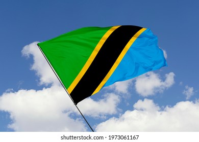 Tanzania flag isolated on sky background with clipping path. close up waving flag of Tanzania. flag symbols of Tanzania.