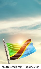 Tanzania national flag waving in beautiful clouds.