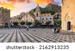 Taormina and San Giuseppe church on the square Piazza IX Aprile in Taormina. Sicily, Italy. Square Piazza IX Aprile with San Giuseppe church and Clock Tower in Taormina, Sicily, Italy.