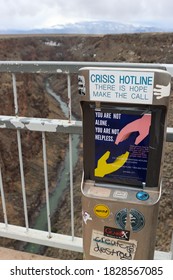 Taos, New Mexico / USA - March 8, 2020 : Out Of Order Crisis Hotline Phone On The Taos Bridge 