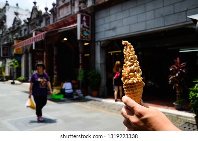 Taoyuan, Taiwan - AUG 01, 2018:Hand Holding Ice Cream In Daxi Old Street.