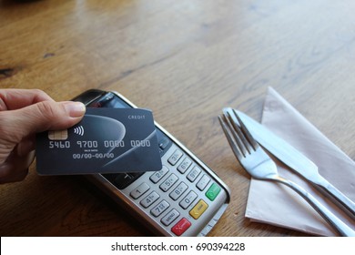 Tap Card Pay Chip Pin - Coronavirus Covid 19 Ban Concept -contactless Payment Card Pdq Background Copy Space With Hand Holding Credit Card Ready To Pay At Cafe Stock, Photo, Photograph, Picture