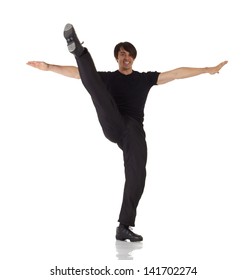 Tap Dancer In Blue Jeans And Tap Shoes Doing Steps On A White Background And Floor