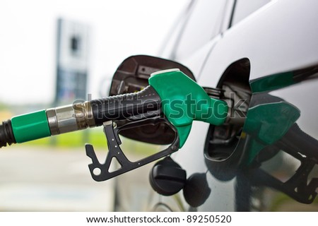 a tap for gasoline at a gas station. refuel a car