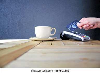 Tap Pay Credit Card Coronavirus Covid 19 Ban Concept -contactless Payment Card Pdq Background Copy Space With Hand Holding Credit Card To Pay At Cafe Restaurant Coffee Shop Smartcard Stock Photograph