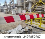 Tap red white color warning barrier safety hazard caution stop line sign in industrial factory area
