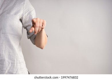 Tap The Screen With Your Finger, Use The Virtual Interface. Businesswoman In A Casual Gray Shirt Makes A Hand Gesture