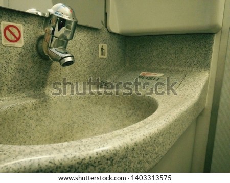 Tap and sink in the plane. Mission:Washing hands to prevent infection.