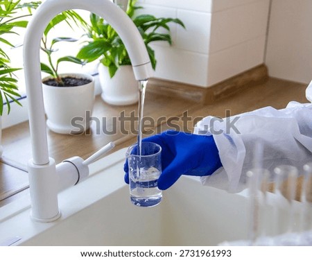 Tap water samples for analysis. Selective focus. home.
