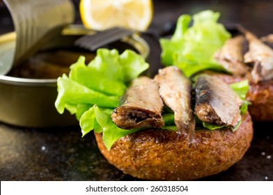 Tapas bun burger with smoked sardines or sprats - Shutterstock ID 260318504
