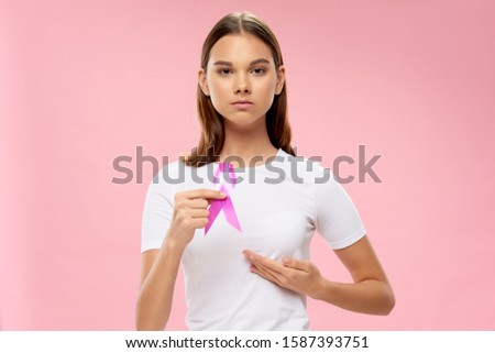 Tape in the hands of a woman oncology charity fund raising assistance