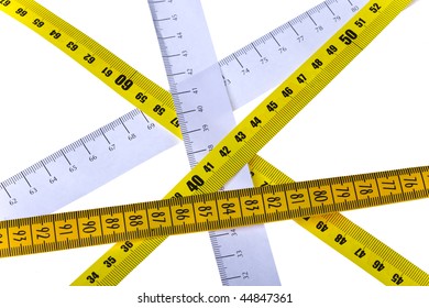 tape measures cross on white background