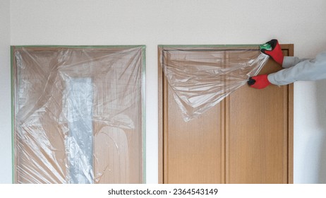 A tape that combines a masking tape and a vinyl sheet.Protect your closets and doors from dirt. - Shutterstock ID 2364543149