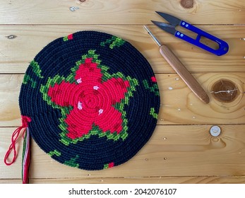 Tapestry Crochet Or Wayuu Mochila Crochet Bag With Cotton Yarn On Wood Background.