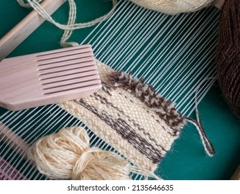 Tapestry woven by hand on a loom with a weft beater. Fiber craft discipline. Weft-faced weaving