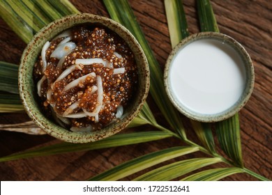 Tapioca pearls form sago tree. Still life photography of Thai dessert Sago palms with coconuts or sago pearls in coconut milk on the table. Popular dessert in Thailand served with fresh coconut milk.