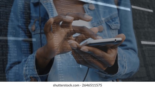 Tapping developer hands in denim jacket on phone touchscreen at tech workspace, with code overlay. Technology, innovation, coding, software, digital, software engineer, modern