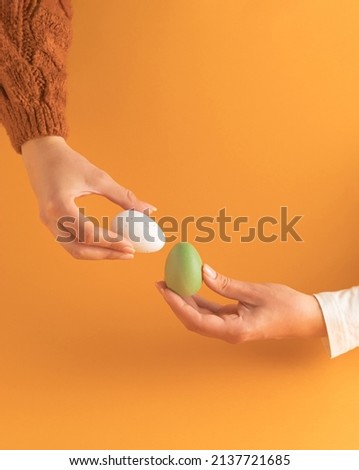 Tapping the Easter eggs - egg knocking game. Egg fight illustration photo. Happy Easter.