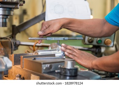 The tapping operation by skill worker. The thread making by hand tapping tool with 