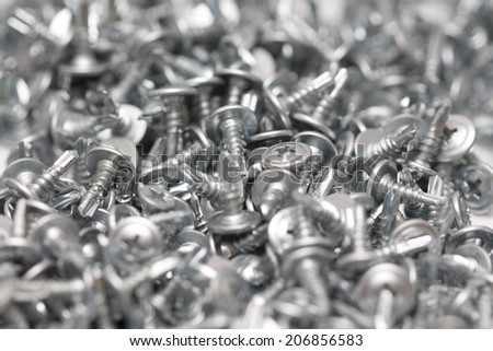 tapping screw on white background macro