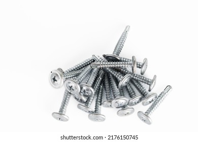 Tapping screws made of steel on white background, metal screw, iron screw, chrome screw, screws as a background, wood screw, concept industry. copy space for text.
