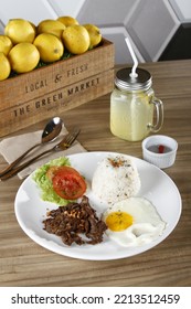 Tapsilog, A Filipino Breakfast Of Beef Tapa, Fried Rice And Eggs