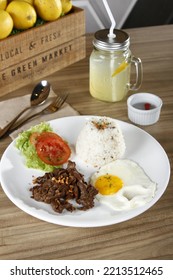 Tapsilog, A Filipino Breakfast Of Beef Tapa, Fried Rice And Eggs