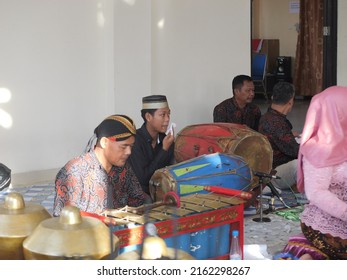 Tarakan, Indonesia. 05312022: Indonesian musicians playing Gamelan traditional Javanese ensemble music. Man playing gamelan in Tarakan, Indonsia.