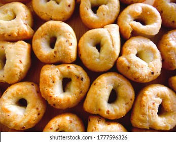 Taralli Or Tarallini - Italian Bagel Pretzel Regional Apulia & Puglia Food. Taralli - Traditional Italian Food Typical Of Apulia Regional Cuisine, Top View Background. Salted Bread Sticks Snack