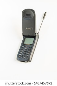 Taranto, Italy - 24 August 2019: Historic GSM Motorola Startac Mobile Phone Photographed On A White Background, Antenna Extracted, Vertical Image.