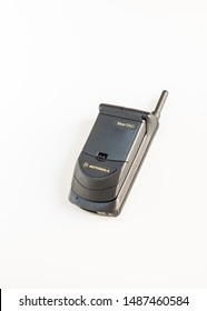 Taranto, Italy - 24 August 2019: Historic Mobile Gsm Motorola Startac With Closed Flip Photographed On A White Background, Vertical Image.