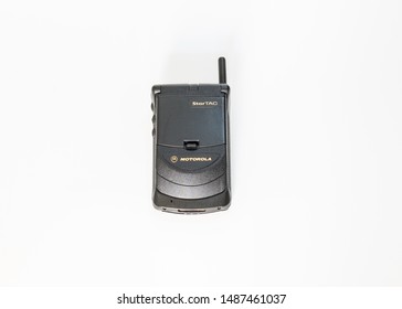 Taranto, Italy - 24 August 2019: Historic Mobile Gsm Motorola Startac With Closed Flip Photographed On A White Background, Horizontal Image.