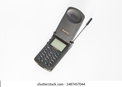 Taranto, Italy - August 24, 2019: Historic GSM Motorola Startac Mobile Phone Photographed On A White Background, Antenna Extracted, Horizontal Image.