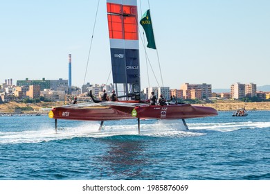 Taranto, Italy - June 4, 2021: Rear View Of The F50 Catamaran As It Enters The Piccolo Sea, British Team, In The Background You Can See The Coast Of The City And The Ex-Ilva Steel Factory.