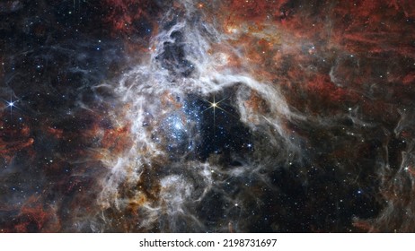 The Tarantula Nebula by Webb Space Telescope. Elements of this picture furnished by NASA - Shutterstock ID 2198731697