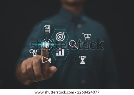 Target customer and buyer persona concepts in marketing strategies. Personalization and customer-centric approach emphasized. Businessman touches screen to target customer.