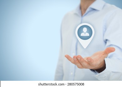 Target customer and human resources (HR) concept. Man hold target customer, employee (or another business person) in hand. - Shutterstock ID 280575008