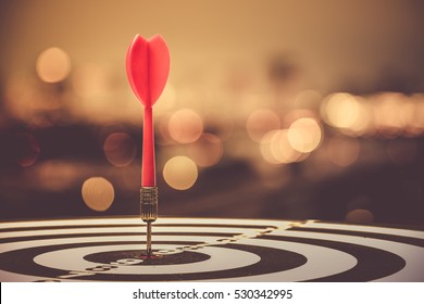 target dart with arrow over blurred bokeh background ,metaphor to target marketing or target arrow concept. - Shutterstock ID 530342995