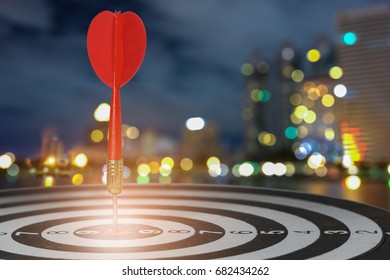 target dart with arrow over blurred bokeh background ,metaphor to target marketing or target arrow concept. - Shutterstock ID 682434262