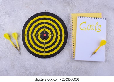 Target And Goal Concept With Darts, Arrows, And Office Accessories