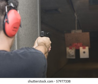 Target Practicing With Gun In The Shooting Range