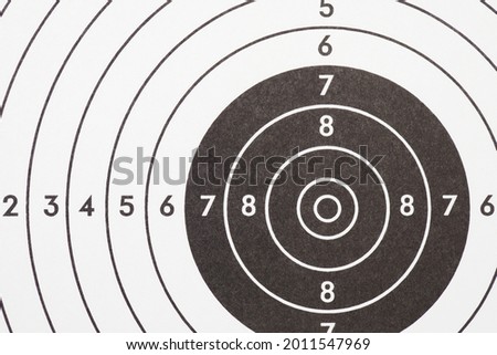 Target for shooting. Black and white light background or wallpaper. Backdrop on the subject of shooting sports and training